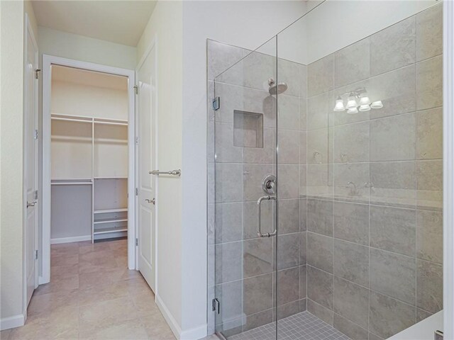 5190 Unity Sq, Vero Beach, FL 32967 - bathroom featuring a shower stall and a spacious closet