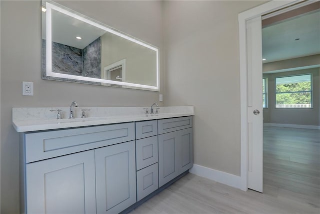 7985 99th Ave, Vero Beach, FL 32967 - bathroom with double vanity and wood finished floors