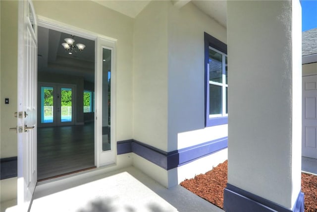 7985 99th Ave, Vero Beach, FL 32967 - view of exterior entry featuring french doors and stucco siding