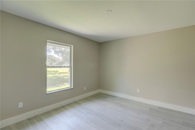 7985 99th Ave, Vero Beach, FL 32967 - unfurnished room featuring light wood-style flooring