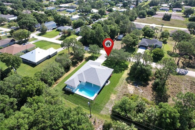 7985 99th Ave, Vero Beach, FL 32967 - aerial perspective of suburban area featuring a pool area