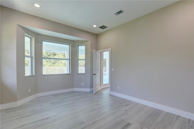 7985 99th Ave, Vero Beach, FL 32967 - unfurnished room with light wood finished floors and recessed lighting