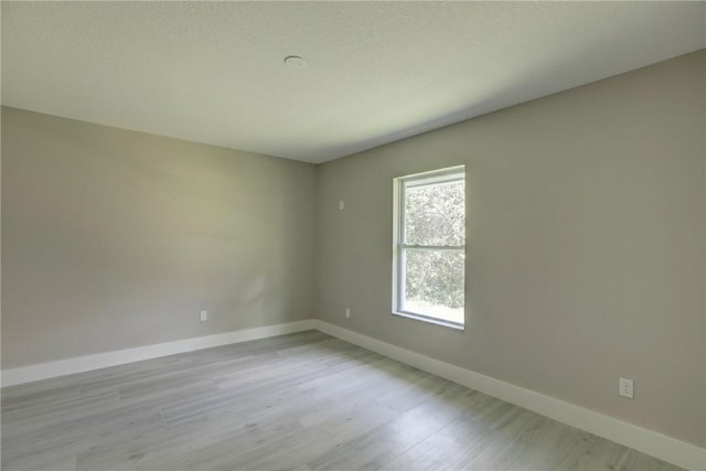 7985 99th Ave, Vero Beach, FL 32967 - unfurnished room featuring wood finished floors