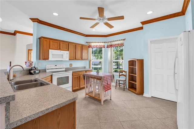 kitchen with a sink, white appliances, ornamental molding, and brown cabinetry