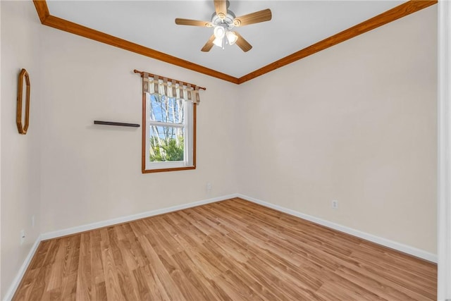 unfurnished room with light wood-style flooring, a ceiling fan, baseboards, and ornamental molding