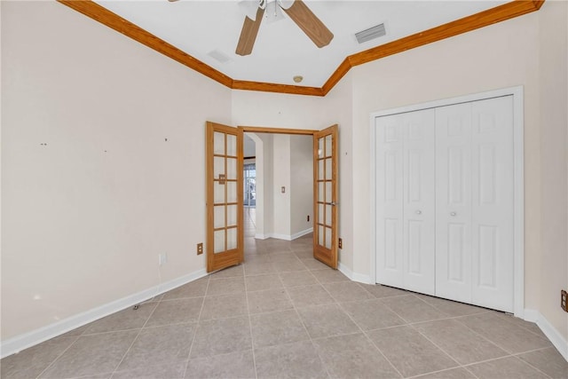 unfurnished bedroom with light tile patterned floors, visible vents, baseboards, french doors, and crown molding