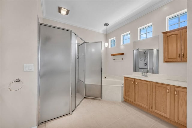 bathroom featuring vanity, a shower stall, a garden tub, and crown molding