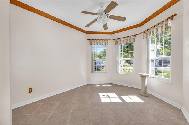 tiled empty room featuring crown molding, baseboards, and ceiling fan