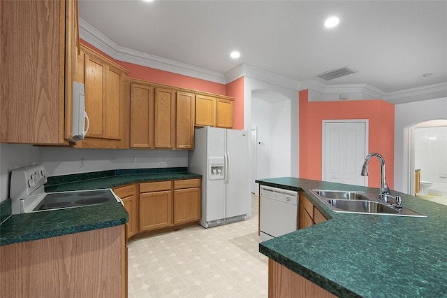 kitchen featuring white appliances, ornamental molding, and sink