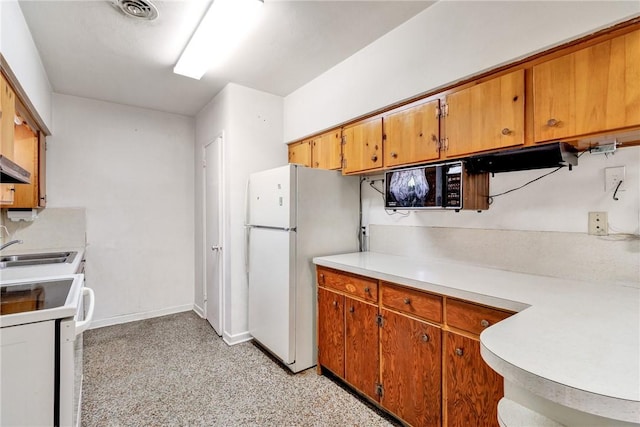 kitchen with sink and white appliances