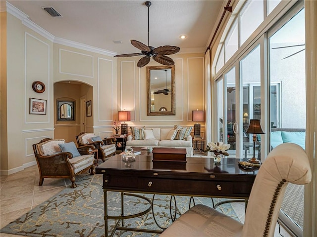 tiled living room featuring ornamental molding and ceiling fan