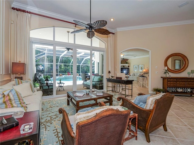 living room featuring ornamental molding, ceiling fan, and light tile patterned flooring