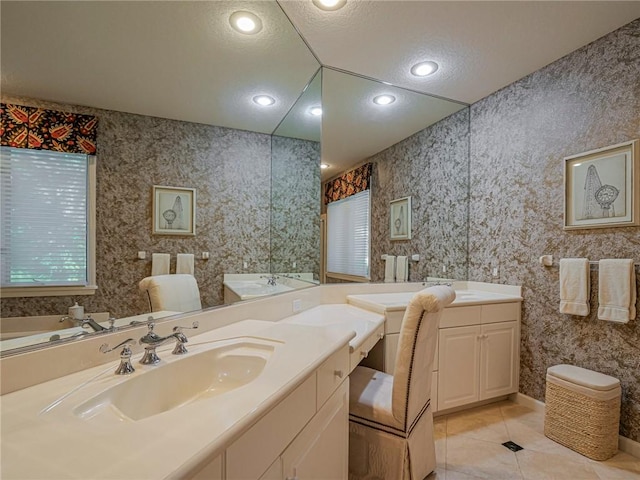 bathroom with tile patterned floors and vanity