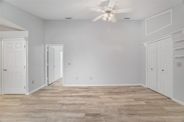 unfurnished room with ceiling fan, high vaulted ceiling, and light hardwood / wood-style floors