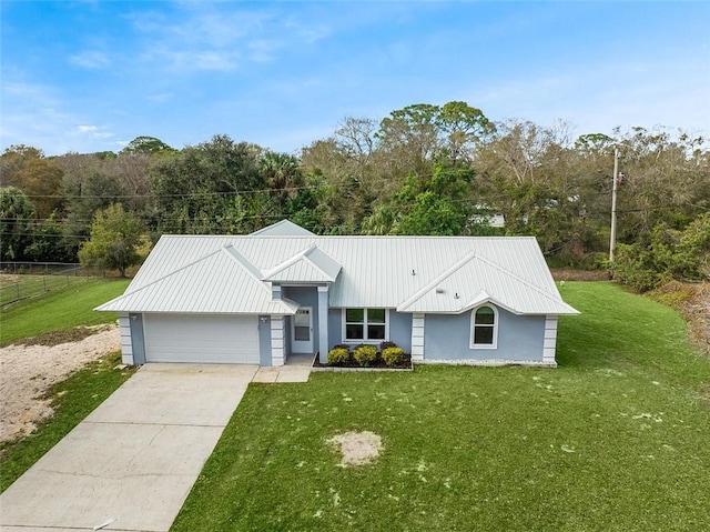 single story home featuring a garage and a front lawn