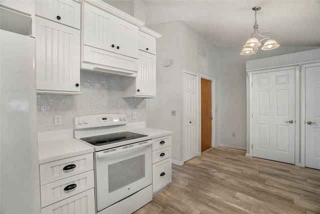 kitchen featuring hanging light fixtures, white cabinetry, light wood-type flooring, and white appliances