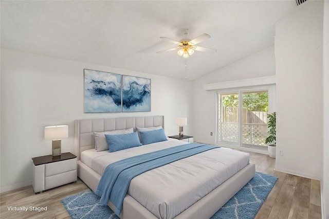 bedroom with vaulted ceiling, access to outside, ceiling fan, and light wood-type flooring