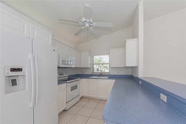 kitchen with white cabinets, lofted ceiling, sink, and white appliances