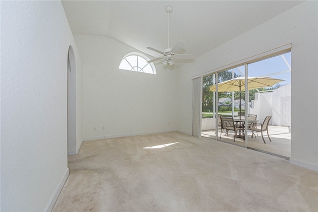 unfurnished room featuring plenty of natural light, light carpet, and ceiling fan