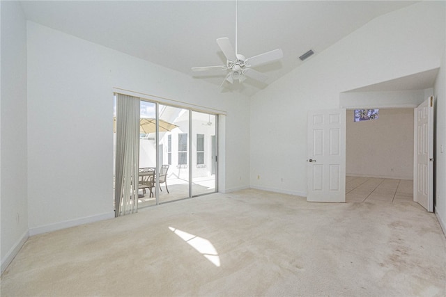 unfurnished room featuring ceiling fan, light carpet, and high vaulted ceiling