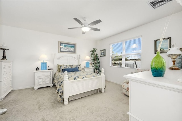 bedroom featuring ceiling fan and light carpet