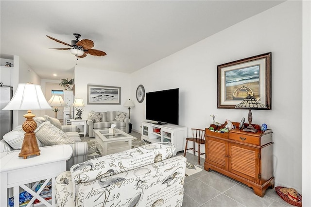 living room with ceiling fan and light tile patterned floors