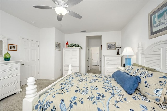 bedroom featuring ceiling fan and light colored carpet