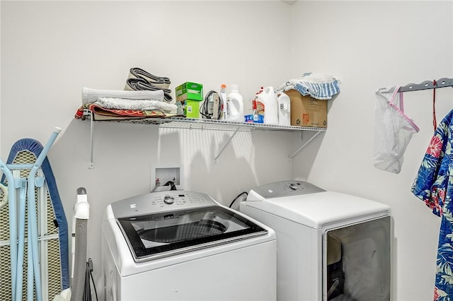 laundry room with washing machine and clothes dryer