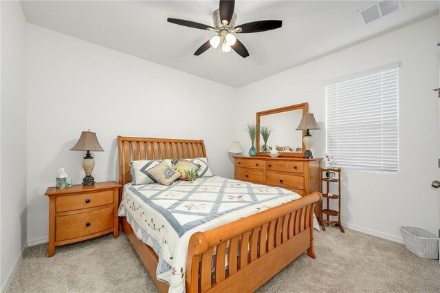 bedroom featuring ceiling fan and light colored carpet