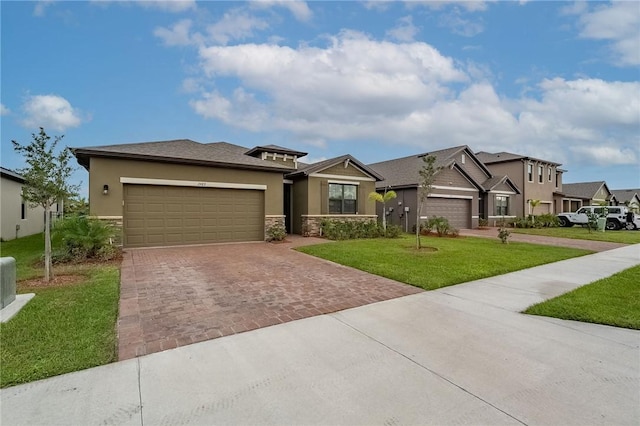 view of front facade with a front yard and a garage