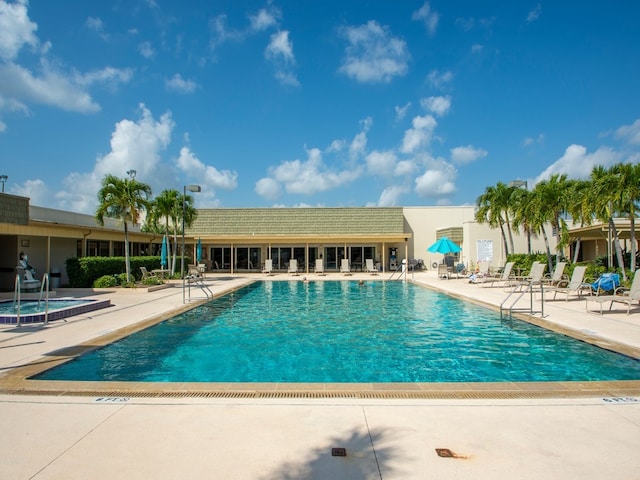 view of swimming pool featuring a patio area