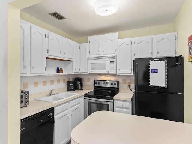 kitchen featuring black appliances, decorative backsplash, white cabinetry, and sink