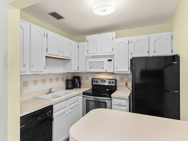 kitchen with white cabinetry, sink, black appliances, and tasteful backsplash