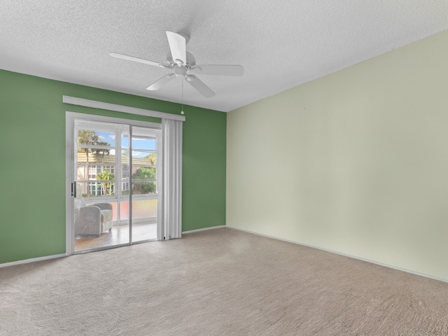 unfurnished room with carpet floors, a textured ceiling, and ceiling fan