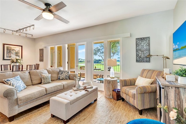 living room featuring ceiling fan and rail lighting