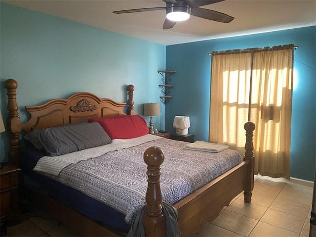 bedroom featuring light tile patterned floors and ceiling fan