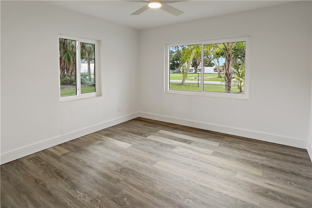 spare room with wood-type flooring and ceiling fan