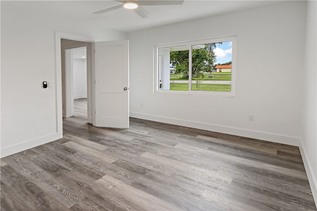 unfurnished room featuring wood-type flooring and ceiling fan