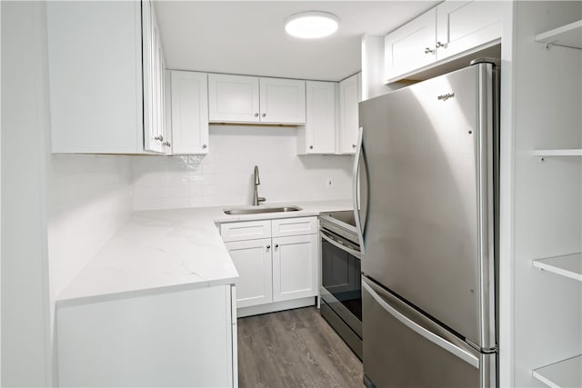 kitchen featuring dark wood-type flooring, white cabinetry, sink, and appliances with stainless steel finishes