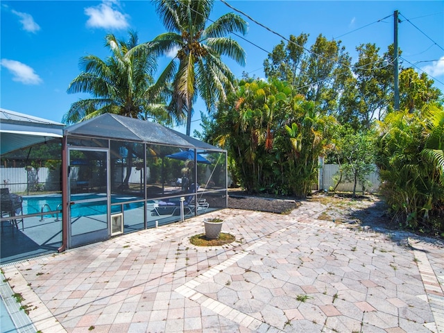 view of patio / terrace featuring fence, a fenced in pool, and a lanai