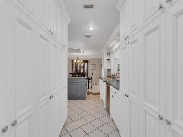 kitchen with white cabinetry, an inviting chandelier, visible vents, and dishwasher