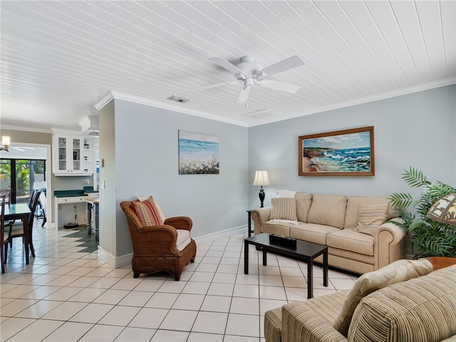 living room featuring light tile patterned floors, ornamental molding, and ceiling fan with notable chandelier