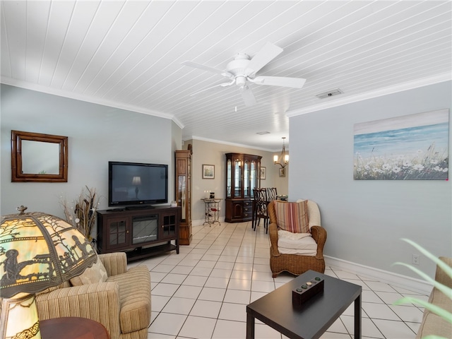 living room with crown molding, ceiling fan with notable chandelier, baseboards, light tile patterned floors, and visible vents