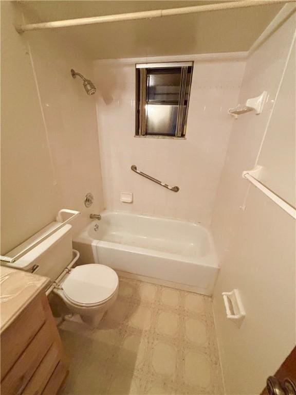 bathroom featuring tile patterned floors, shower / washtub combination, toilet, and vanity