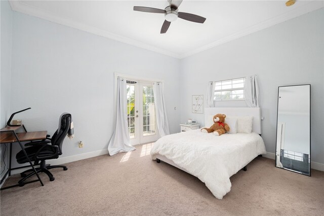 carpeted bedroom featuring access to exterior, ornamental molding, multiple windows, and ceiling fan