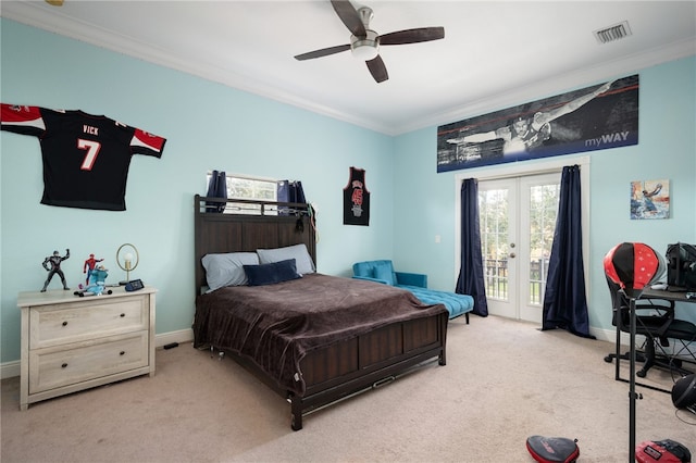 carpeted bedroom with access to exterior, french doors, ornamental molding, and ceiling fan