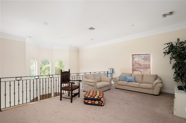 carpeted living room featuring ornamental molding