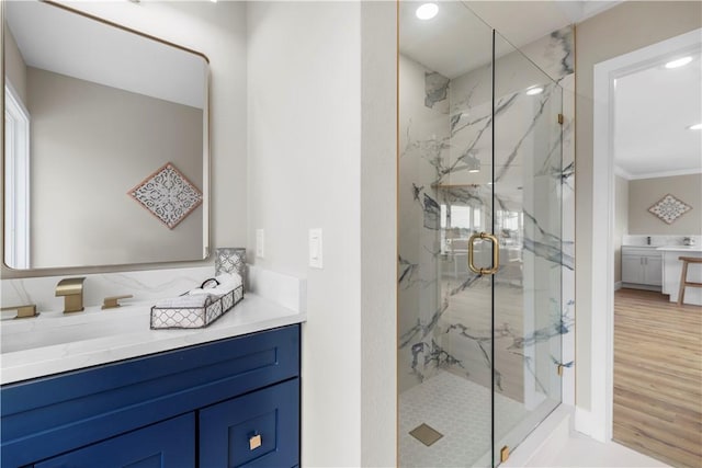 25 Park Ave, Vero Beach, FL 32960 - full bath with a marble finish shower, vanity, recessed lighting, crown molding, and wood finished floors