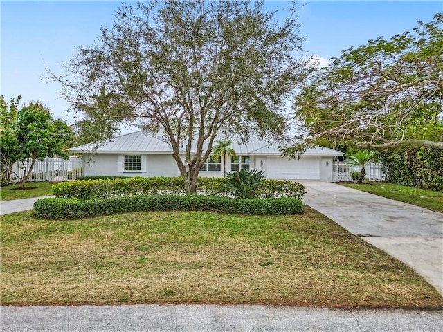 ranch-style house with a garage and a front yard