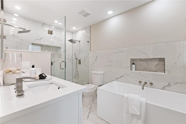 25 Park Ave, Vero Beach, FL 32960 - bathroom with marble tiled flooring, tile walls, a marble finish shower, a soaking tub, and toilet